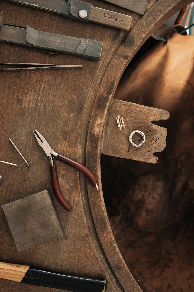 Red chair against industrial backdrop — editorial still life